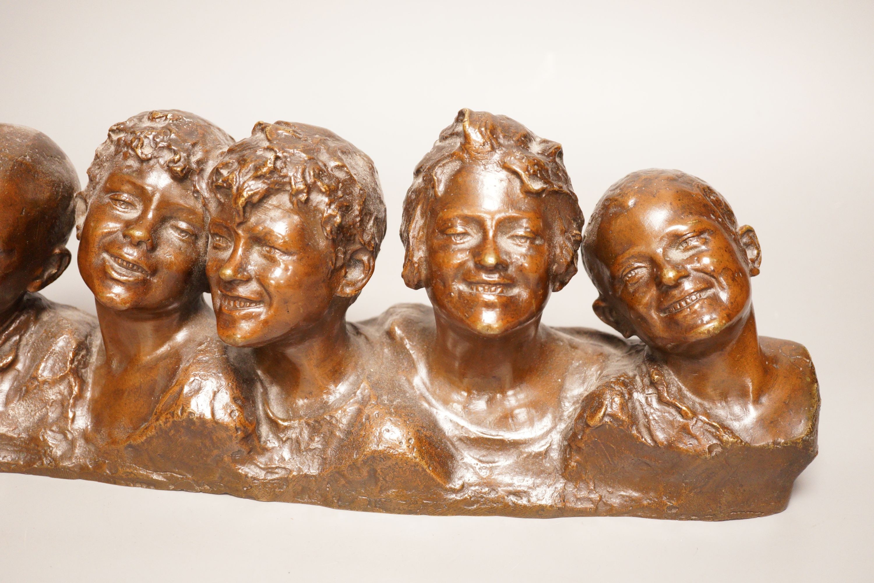 Vincenzo Aurisicchio, (Napoli 1855-1926) a bronze bust group of five smiling children, signed to reverse 40cm wide